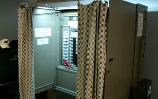 "University at Buffalo voting booth" by Dsw4 - Own work. Licensed under Public Domain via Wikimedia Commons - https://commons.wikimedia.org/wiki/File:University_at_Buffalo_voting_booth.jpg#/media/File:University_at_Buffalo_voting_booth.jpg